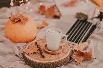 A good autumn and halloween afternoon enjoying a cup of hot chocolate with trinkets in my bed