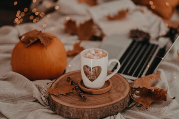 A good autumn and halloween afternoon enjoying a cup of hot chocolate with trinkets in my bed