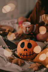 Enjoying Halloween in bed, with a good hot cup and sweets and the laptop at home