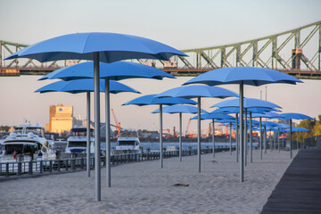 white sandy beach with beautiful blue umbrellas at old port of Montreal
