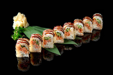 Sushi roll with salmon, avocado, philadelphia cheese on black background. Sushi menu. Japanese food.