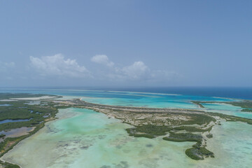 Aerial Landscape Caribbean island with shore coast of various shades of blue in Los Roques, National Park
