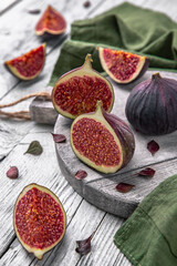 Juicy ripe figs. Whole fruit and cut into halves. Healthy, fortified, dietary food.