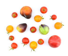 Top view of various tomatoes isolated on white background.  Healthy vegetarian food concept.
