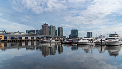Obraz premium Docklands is a modern harbour development dominated by high-rises and popular for its shopping and waterside dining.