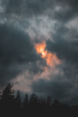 Orange Sun Behind Clouds