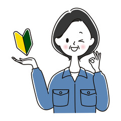 初心者OKサインを出す作業服のシニア女性