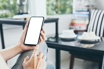cell phone mockup blank white screen.woman hand holding texting using mobile on desk at coffee shop.background empty space for advertise.work people contact marketing business,technology