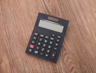 There is a calculator on the table