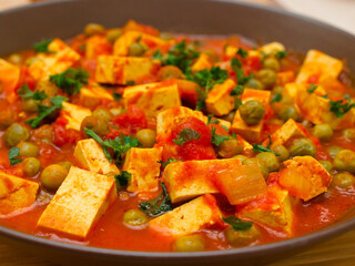 Vegan tofu and green peas curry