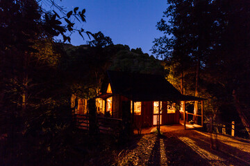 house in the woods at night