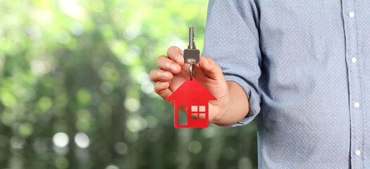 Real estate agent handing over house keys