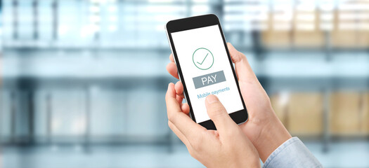 Hand holding smartphone device  touching screen