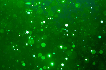 green bokeh on black background