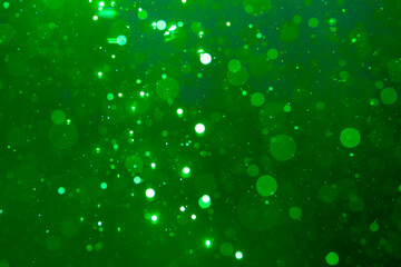 green bokeh on black background