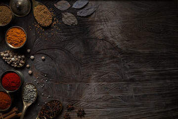 Condiment of indian food Spice garnish background on wood table top view. Seasoning of Asian...