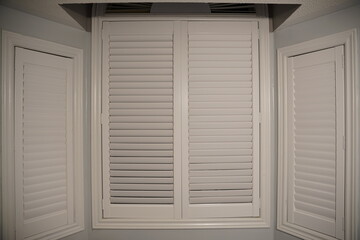 Fototapeta premium white wooden window with shutters