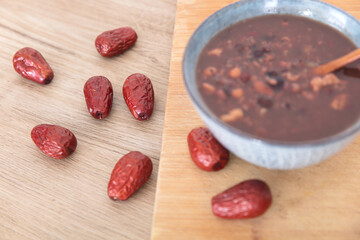 A bowl of Chinese traditional delicacy eight-treasure porridge and scattered jujube