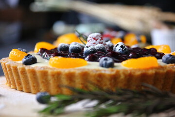 close up topping of  mix fruits pie  with icing
