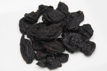 Garcinia atroviridis or Garcinia Cambogia fruit gummi-gutta , Gambooge also called Kudampuli dried. Sun dried Malabar tamarind or brindleberry