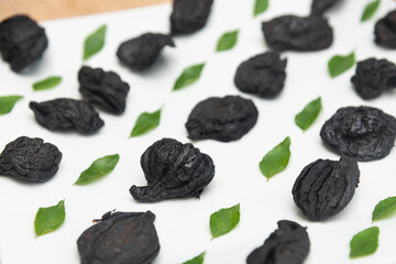 Garcinia atroviridis or Garcinia Cambogia fruit gummi-gutta , Gambooge also called Kudampuli dried. Sun dried Malabar tamarind or brindleberry