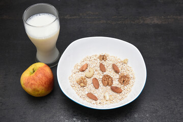 Home made protein bar or balls with whey protein powder, almonds, oats, walnuts, milk, honey or jaggery syrup. Healthy snack for body builders for muscle building in India. diet food. 