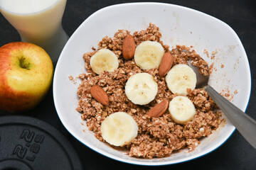 Home made protein bar or balls with whey protein powder, almonds, oats, walnuts, milk, honey or jaggery syrup. Healthy snack for body builders for muscle building in India. diet food. 