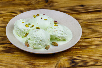 Pistachio ice cream on wooden table