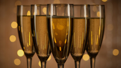 champagne glasses over Holiday Bokeh Blinking background, rotating. Glasses with Sparkling Wine 