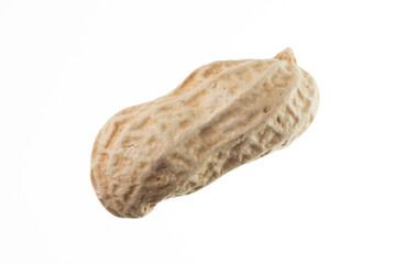 Unpeeled peanut isolated on white