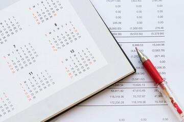 financial statement for check with calendar for business work of personal arrangement flat lay style at office desk