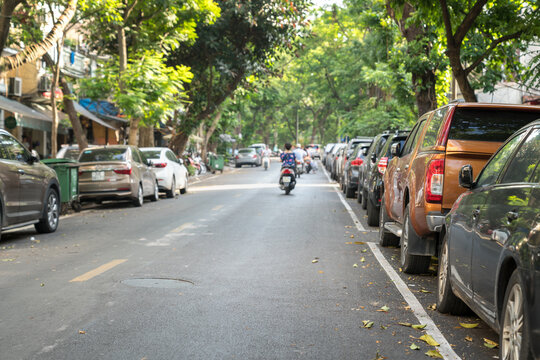 Parallel parking cars on urban street. Outdoor parking on road