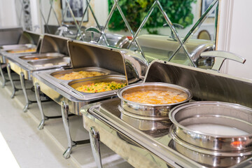 Food in heated trays in buffet