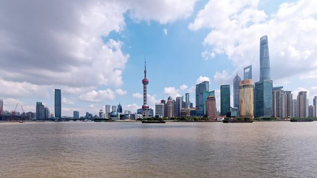 beautiful Shanghai bund cityscape with blue sky and white clouds background in afternoon, 4k footage, time lapse video.