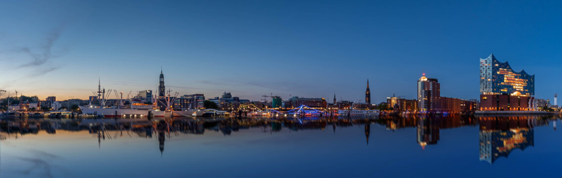 Hamburg skyline at night with reflection on Elbe