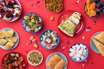 Traditional turkish delight on red background. Top view. Flat lay. Copy space. Arab dessert,...