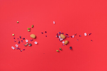 Middle Eastern sweets on red background. Arab dessert, baklava, halva, rahat lokum, sherbet, nuts, pistachios, dates, raisins, dried apricots, churchkhela, cookies. Top view. Flat lay. Copy space