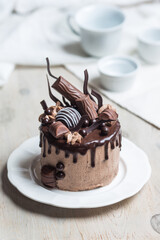Chocolate candy cake with ganache and decoration