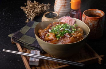 Japanese grilled pork with sauce on rice.