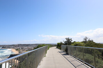 Beach life and blue sky in this popular tourist destination of the historical Anzac Memorial walk located in New Castle NSW Australia.