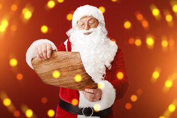 Santa Claus reading wish list against color background