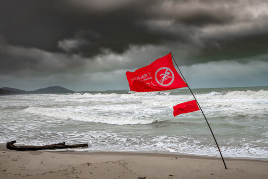 Red flag warning on the beach.