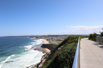 Beach life and blue sky in this popular tourist destination of the historical Anzac Memorial walk located in New Castle NSW Australia.
