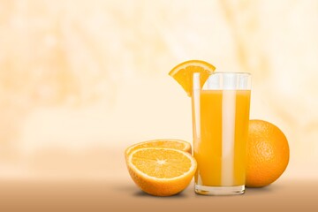 Orange juice in glass and slices of orange fruit