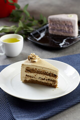 Coffee cake on the table with tea cup at cafe