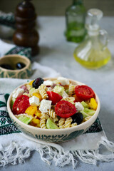 Greek salad with pasta.  .selective focus