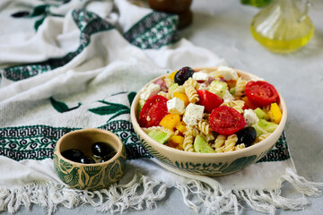 Greek salad with pasta.  .selective focus