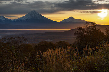 Kamchatka, sunrise over the Koryaksky and Avachinsky volcanoes
