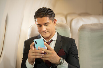 portrait of a businessman on flight alone traveler. Business men and seated passengers ready to leave There is a flight attendant service.