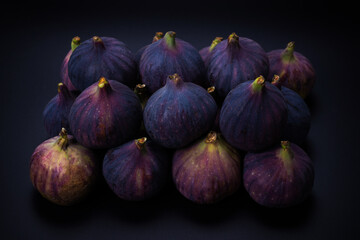 Tasty figs on a black background. Top view.